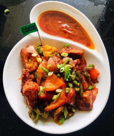Tasty Chilli Paneer (Dry) cooked by COOX chefs cooks during occasions parties events at home