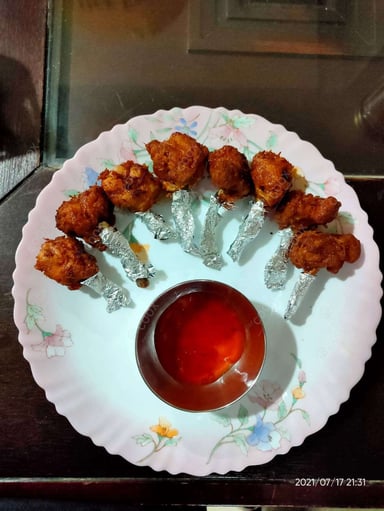 Tasty Chicken Lollipop cooked by COOX chefs cooks during occasions parties events at home