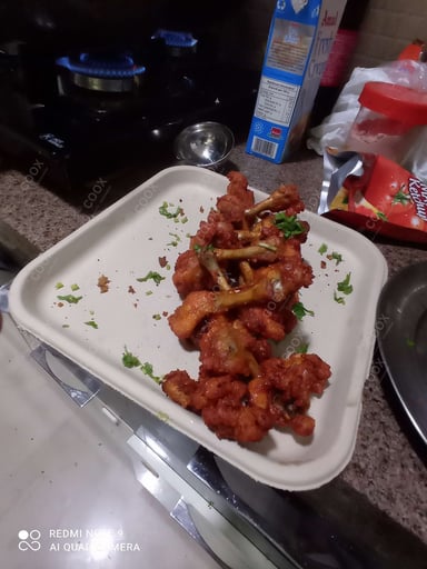 Tasty Chicken Lollipop cooked by COOX chefs cooks during occasions parties events at home