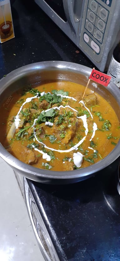 Tasty Mutton Rogan Josh cooked by COOX chefs cooks during occasions parties events at home