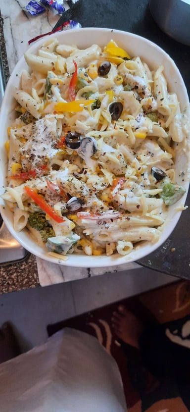 Tasty Pasta in White Sauce cooked by COOX chefs cooks during occasions parties events at home