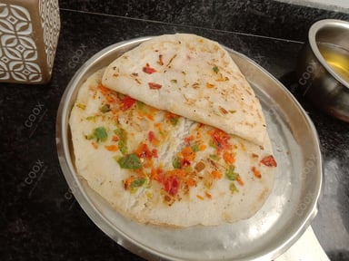 Tasty Mixed Veg Uttappam cooked by COOX chefs cooks during occasions parties events at home