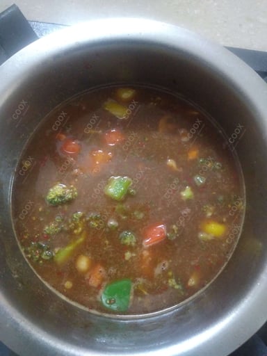 Tasty Mix Veg in Schezwan Sauce cooked by COOX chefs cooks during occasions parties events at home