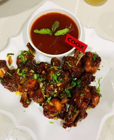 Tasty Chicken Lollipop cooked by COOX chefs cooks during occasions parties events at home
