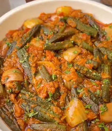 Tasty Bhindi do Pyaza cooked by COOX chefs cooks during occasions parties events at home