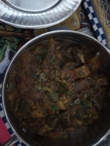 Tasty Baingan ki Sabzi cooked by COOX chefs cooks during occasions parties events at home