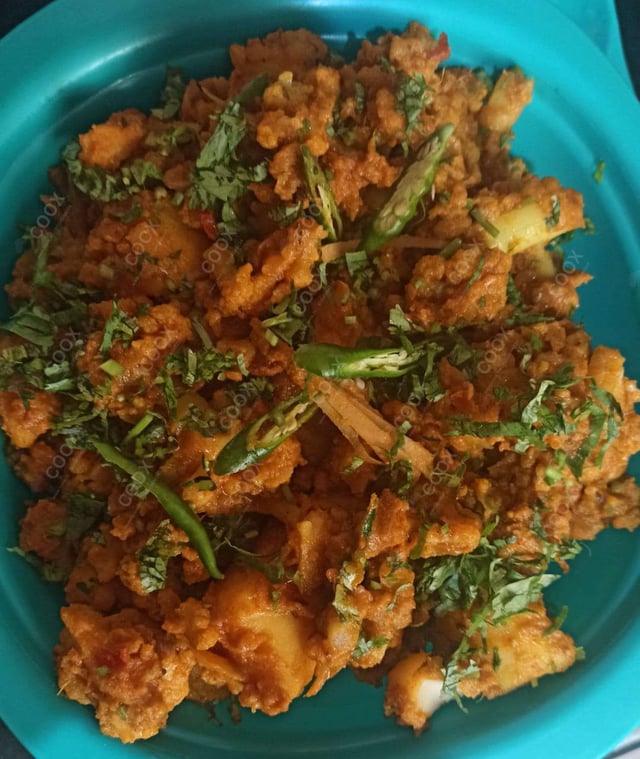 Tasty Aloo Gobhi cooked by COOX chefs cooks during occasions parties events at home