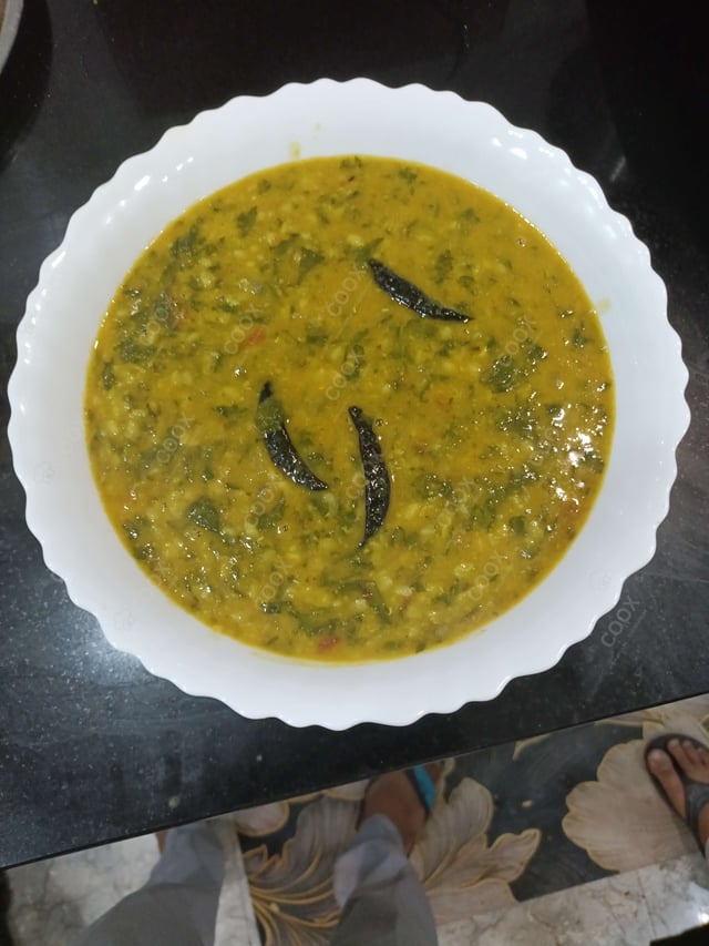 Tasty Palak Dal cooked by COOX chefs cooks during occasions parties events at home