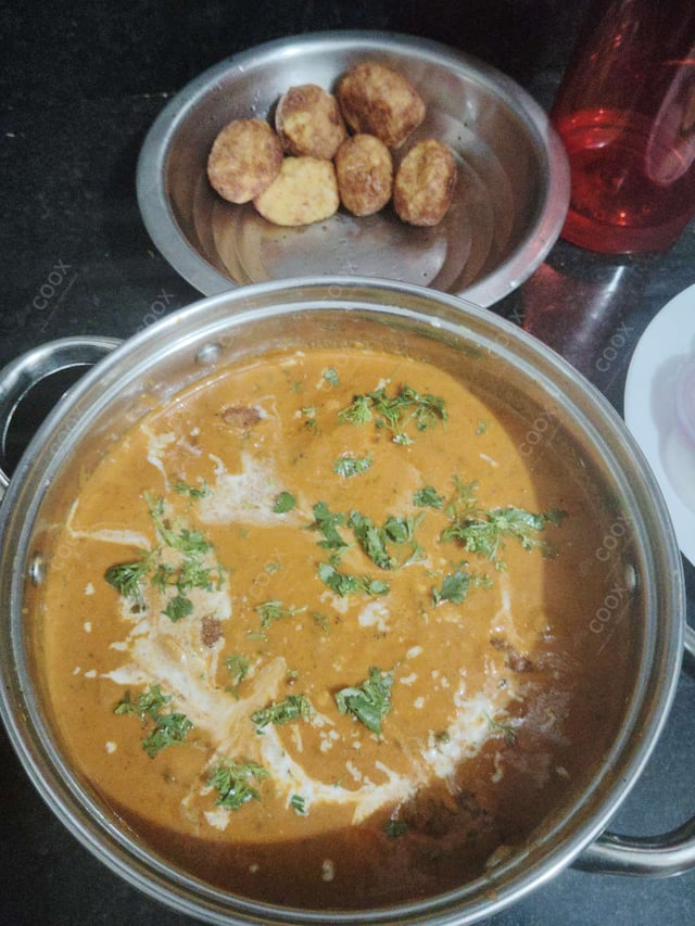 Delicious Malai Kofta (Orange Gravy) prepared by COOX