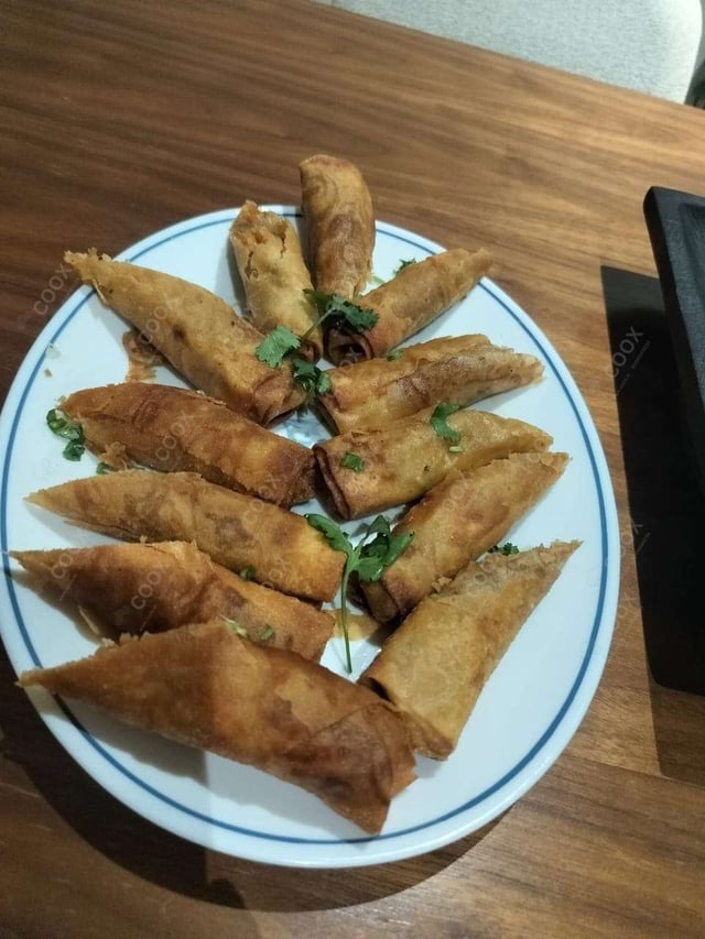 Delicious Veg Spring Rolls prepared by COOX