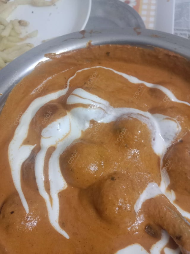 Delicious Malai Kofta (Orange Gravy) prepared by COOX