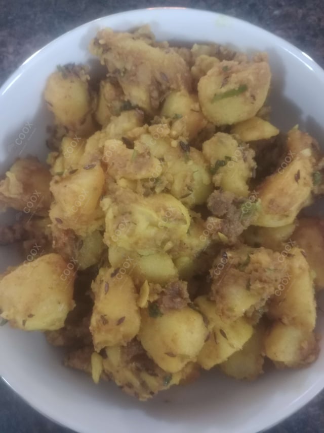 Tasty Jeera Aloo cooked by COOX chefs cooks during occasions parties events at home