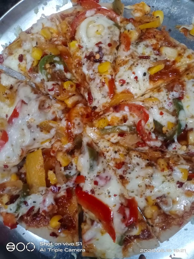 Delicious Veg Pizza prepared by COOX