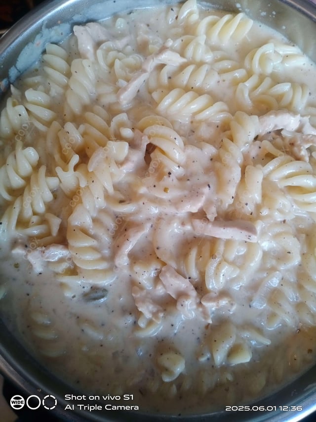 Tasty Chicken Pasta in White Sauce cooked by COOX chefs cooks during occasions parties events at home