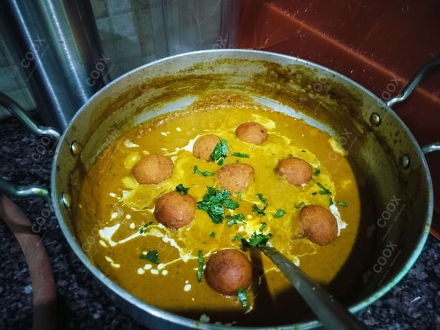 Delicious Malai Kofta (Orange Gravy) prepared by COOX