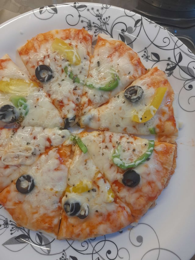 Delicious Veg Pizza prepared by COOX