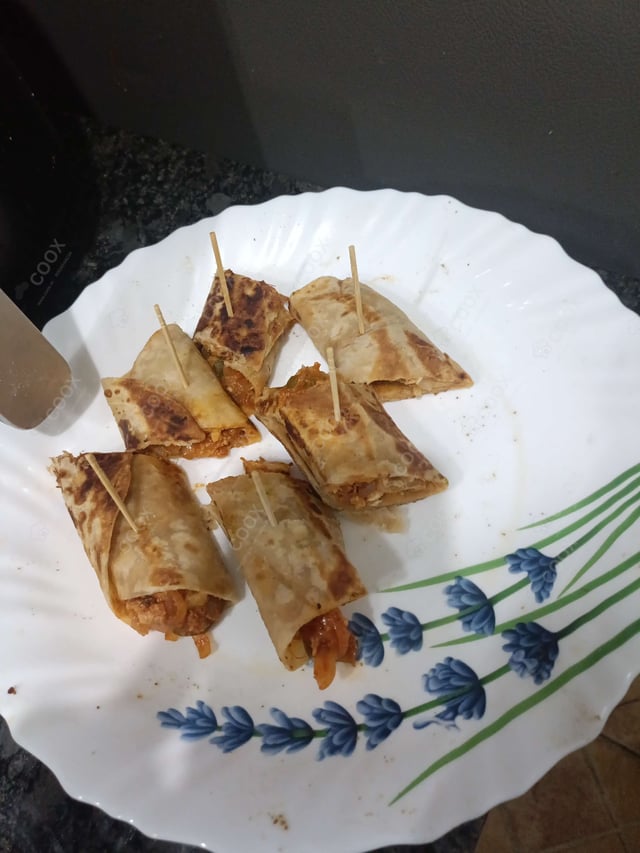 Tasty Chicken Kathi Rolls cooked by COOX chefs cooks during occasions parties events at home