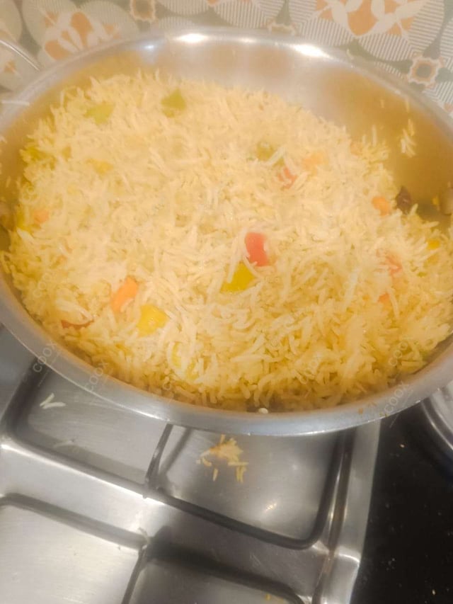 Tasty Schezwan Fried Rice cooked by COOX chefs cooks during occasions parties events at home