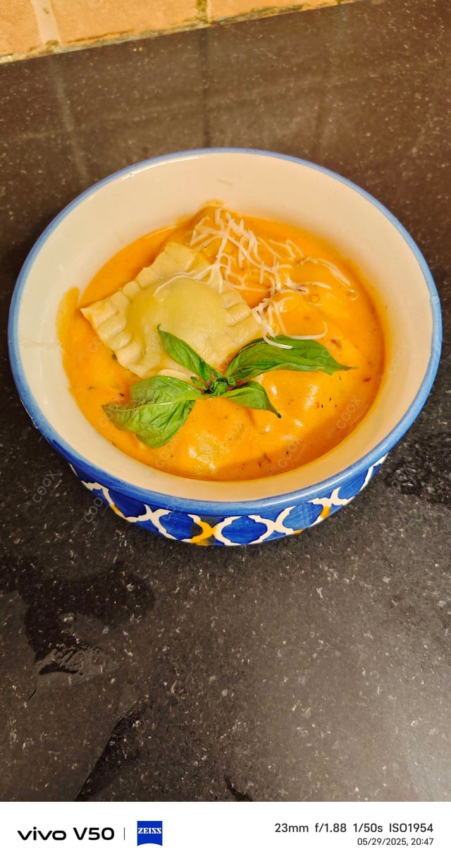 Delicious Ravioli in Pink Sauce prepared by COOX