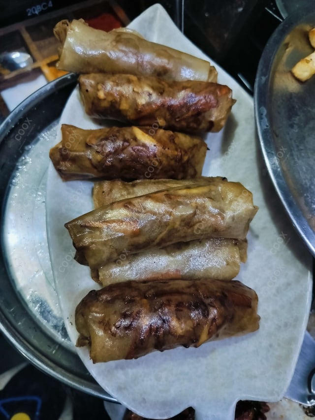 Delicious Veg Spring Rolls prepared by COOX