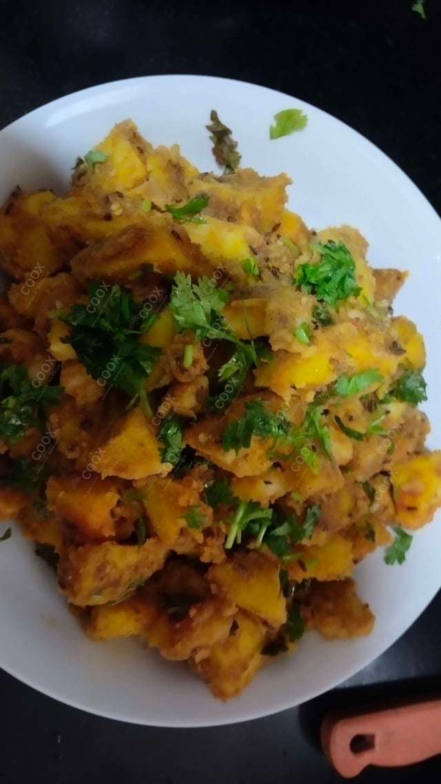 Delicious Jeera Aloo prepared by COOX