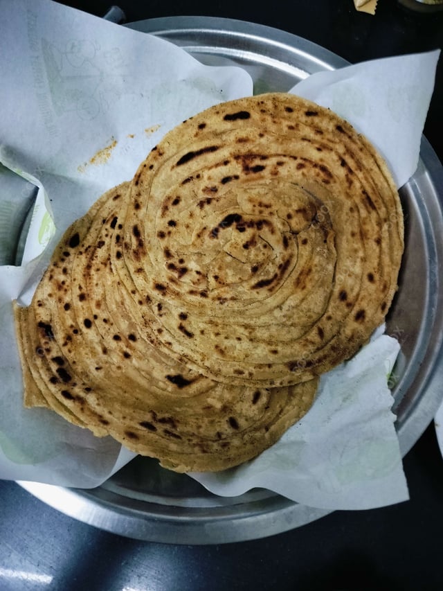 Delicious Lachha Paranthas prepared by COOX