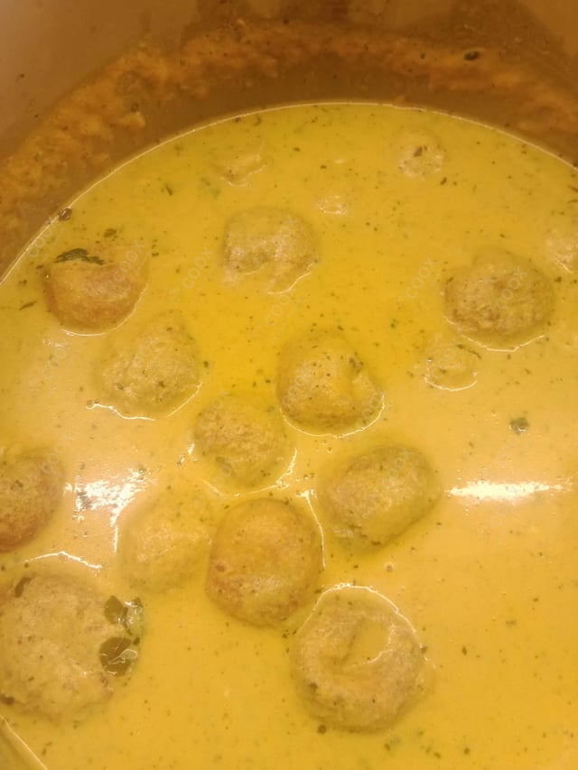 Delicious Malai Kofta (Orange Gravy) prepared by COOX