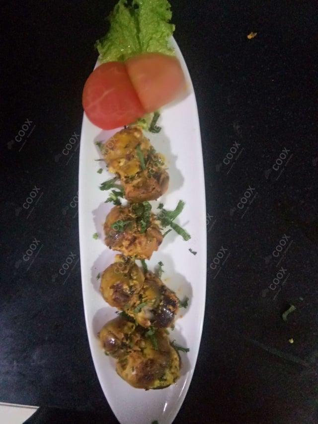 Tasty Mushroom Tikka cooked by COOX chefs cooks during occasions parties events at home