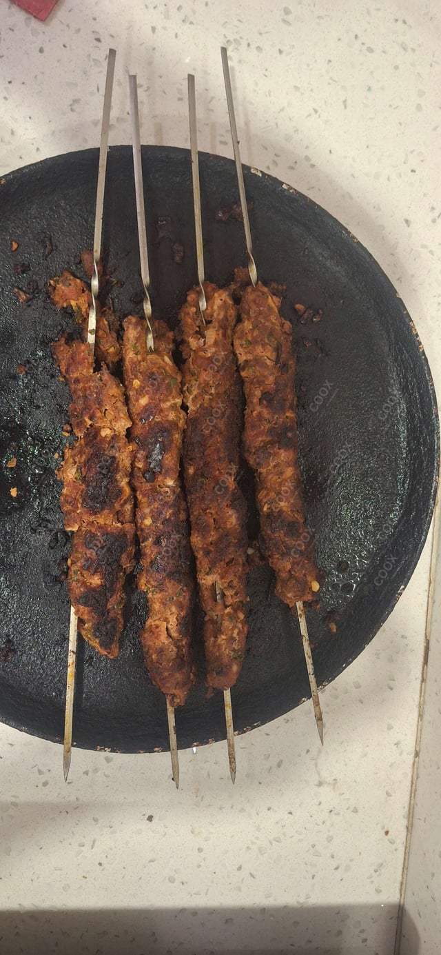 Delicious Mutton Seekh Kebab prepared by COOX