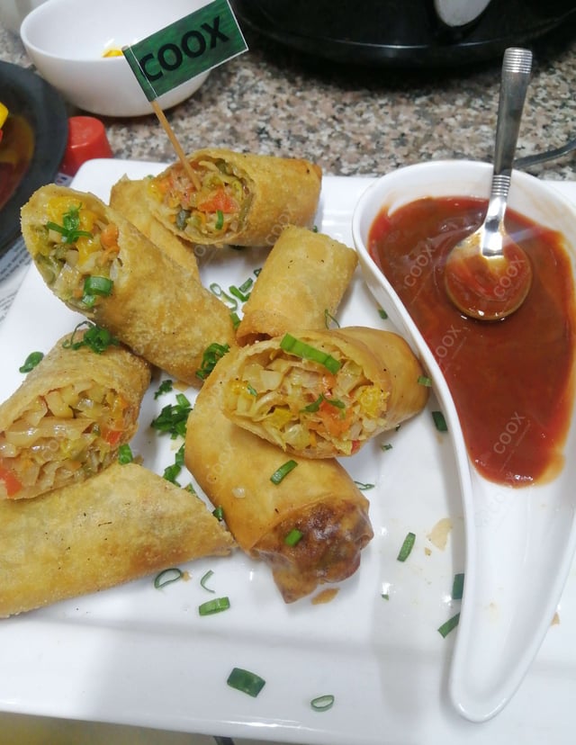 Tasty Veg Spring Rolls cooked by COOX chefs cooks during occasions parties events at home