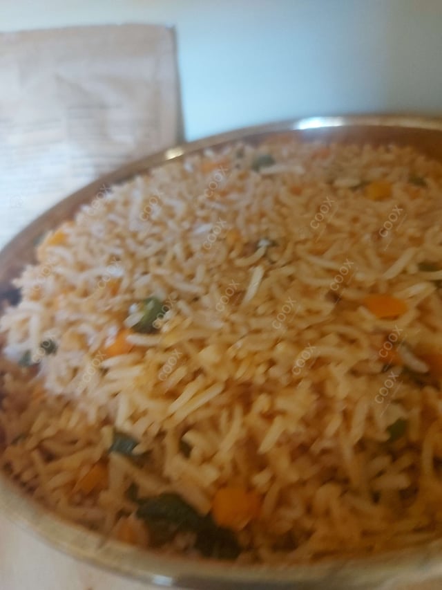 Delicious Schezwan Fried Rice prepared by COOX