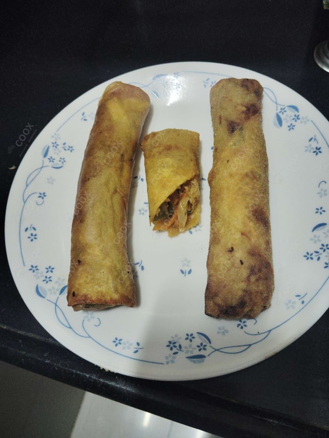 Delicious Veg Spring Rolls prepared by COOX