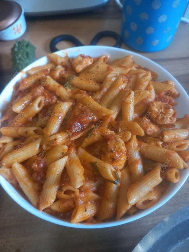 Tasty Chicken Pasta in Red Sauce cooked by COOX chefs cooks during occasions parties events at home