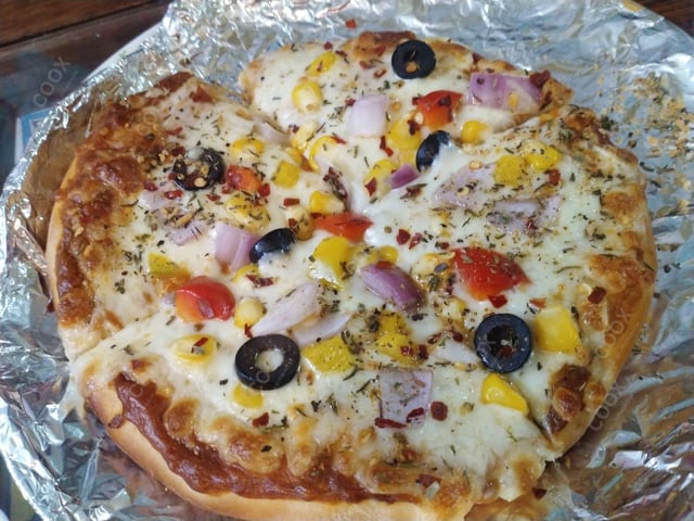Tasty Veg Pizza cooked by COOX chefs cooks during occasions parties events at home