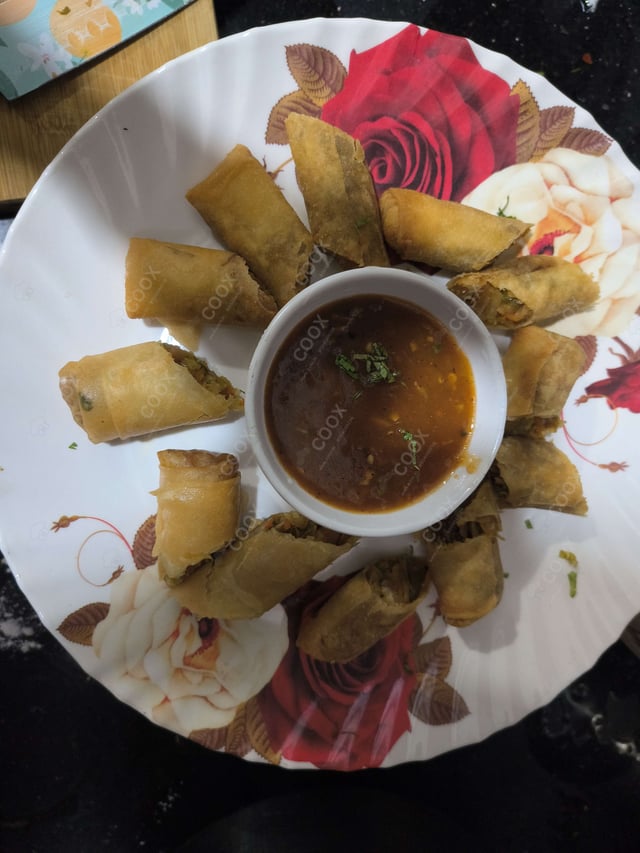 Delicious Veg Spring Rolls prepared by COOX