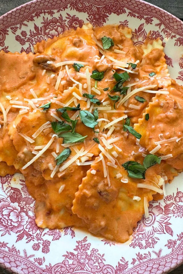 Delicious Ravioli in Pink Sauce prepared by COOX