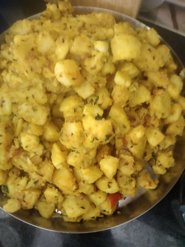 Delicious Jeera Aloo prepared by COOX