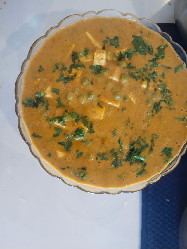 Delicious Matar Paneer prepared by COOX