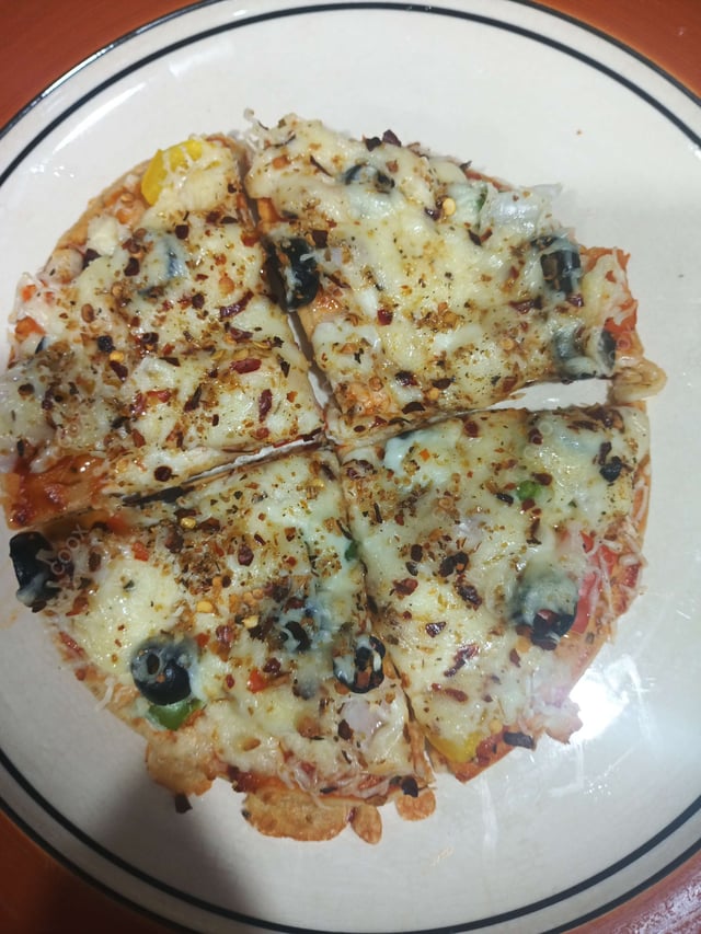 Delicious Veg Pizza prepared by COOX