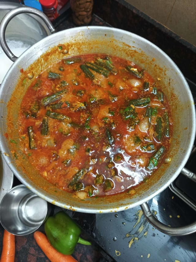 Tasty Bhindi do Pyaza cooked by COOX chefs cooks during occasions parties events at home