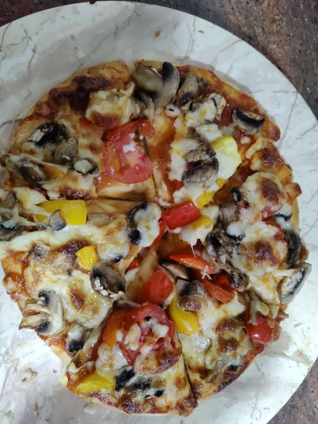 Delicious Veg Pizza prepared by COOX