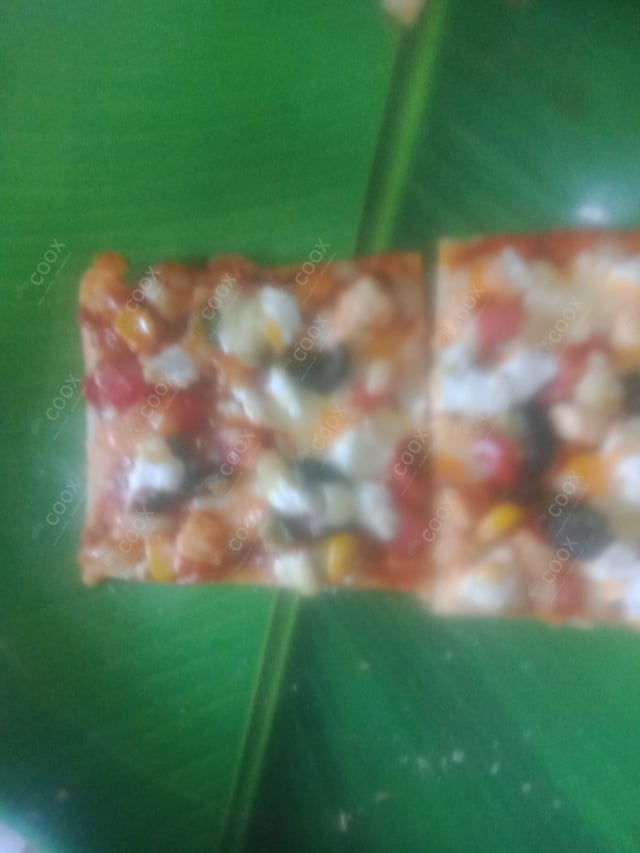 Delicious Veg Pizza prepared by COOX