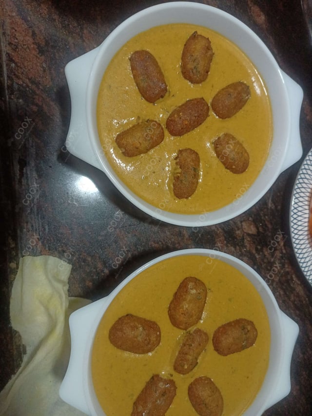 Delicious Malai Kofta (Orange Gravy) prepared by COOX