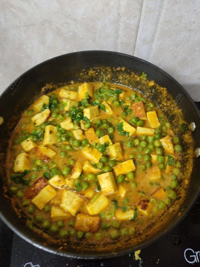 Delicious Matar Paneer prepared by COOX