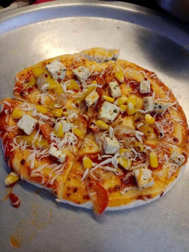 Delicious Veg Pizza prepared by COOX