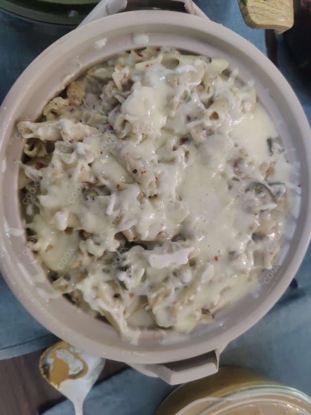 Tasty Chicken Pasta in White Sauce cooked by COOX chefs cooks during occasions parties events at home