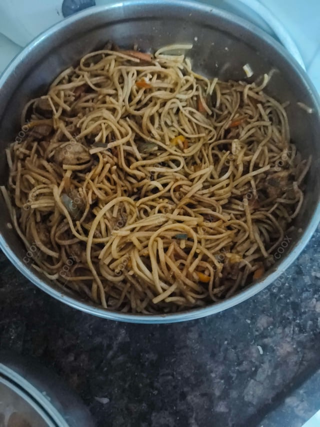 Delicious Chicken Chilli Garlic Noodles prepared by COOX