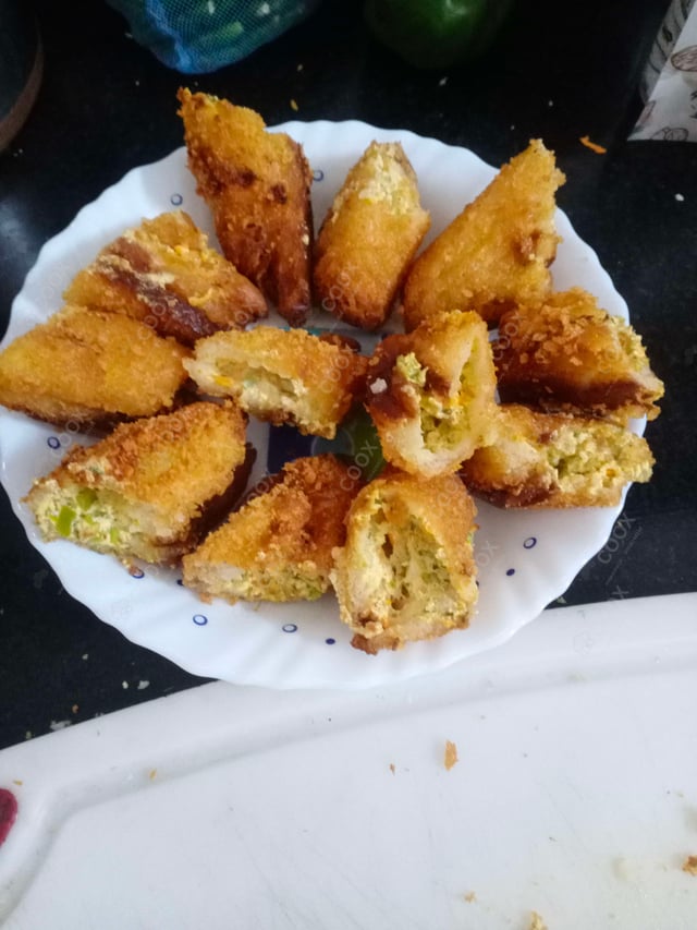 Delicious Dahi ke Sholey prepared by COOX