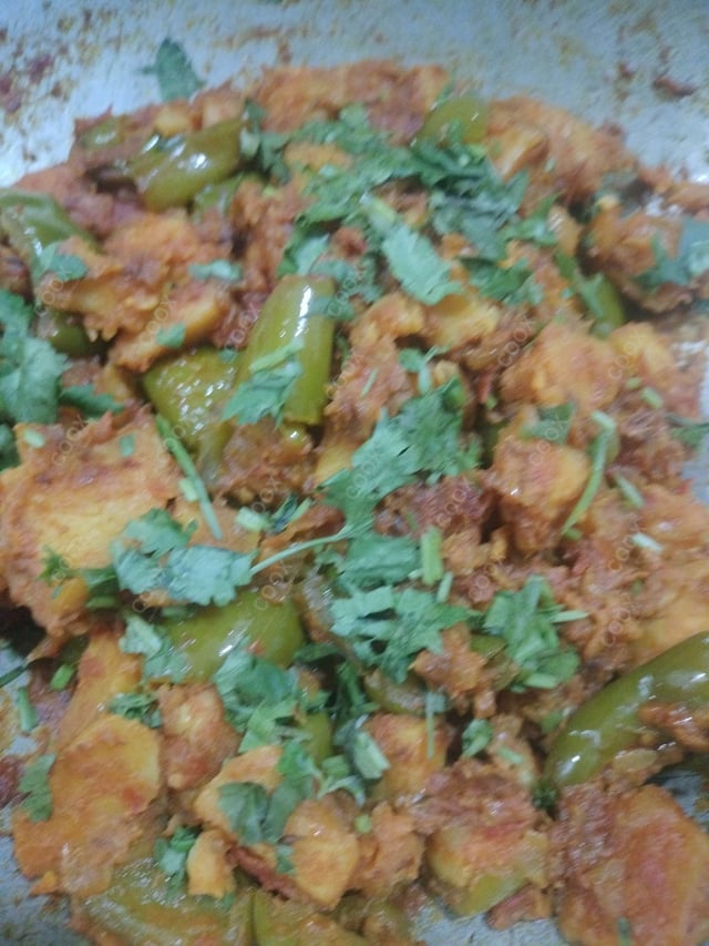 Tasty Aloo Shimla Mirch cooked by COOX chefs cooks during occasions parties events at home