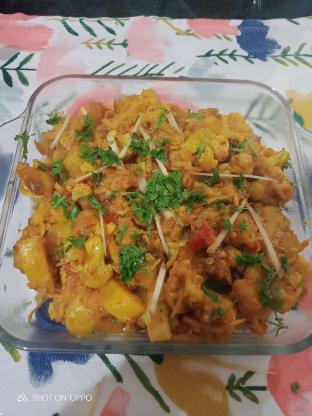 Tasty Aloo Gobhi cooked by COOX chefs cooks during occasions parties events at home